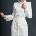 Váy trắng phối dãy nút trước vải dập họa tiết cùng màu-Nguyen.atelier